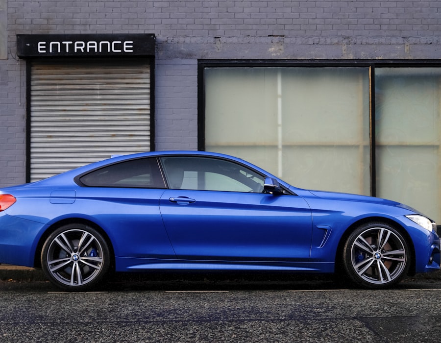 Sleek blue coupe parked outside an entrance, signalling a confident next coverage choice
